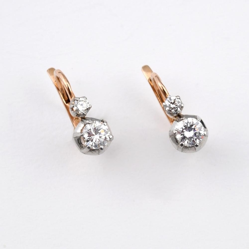 1182 - A PAIR OF FRENCH DIAMOND EARRINGS. each set with two circular-cut diamonds, in 18ct gold, with Frenc... 