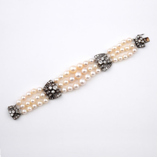 1185 - A DIAMOND AND CULTURED PEARL BRACELET. mounted with three rows of cultured pearls graduating from 6.... 