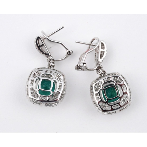 1186 - A PAIR OF EMERALD AND DIAMOND DROP EARRINGS. each set with a cushion-shaped emerald within an openwo... 