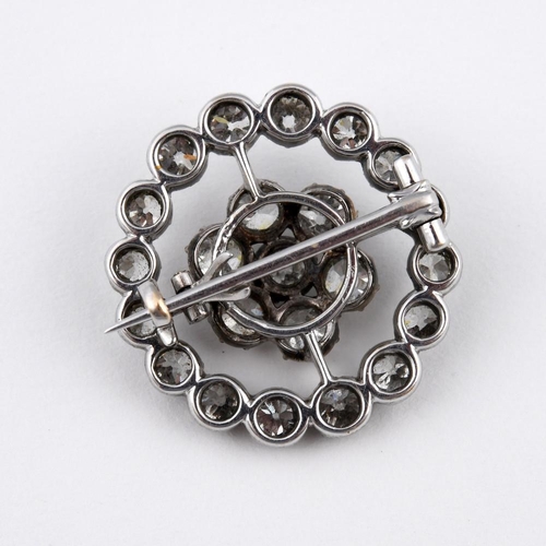 1193 - A DIAMOND TARGET BROOCH. mounted overall with round old-cut diamonds, in silver and backed in white ... 