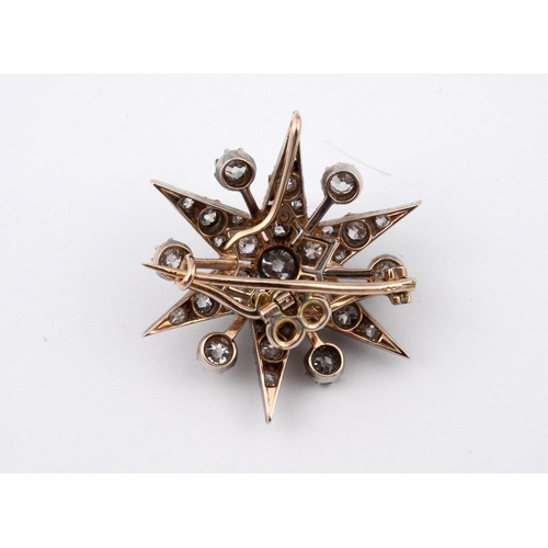 1194 - A VICTORIAN DIAMOND STAR BROOCH PENDANT. set overall with graduated circular-cut diamonds in silver ... 