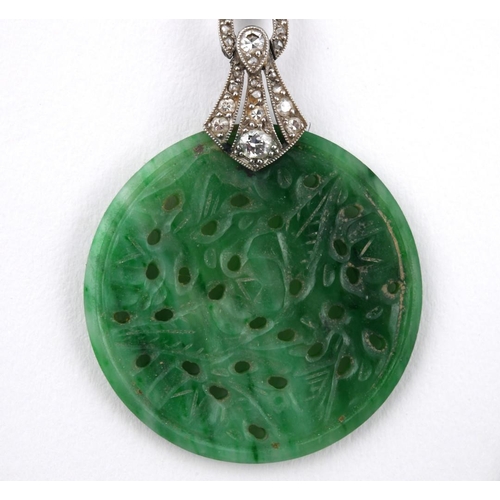 1198 - A PAIR OF ART DECO JADE & DIAMOND DROP EARRINGS. each set with a circular jade disc of foliate carve... 