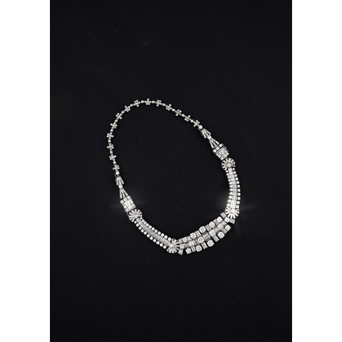 1201 - AN ART DECO DIAMOND NECKLACE. the centre section mounted with round brilliant-cut and baguette-cut d... 