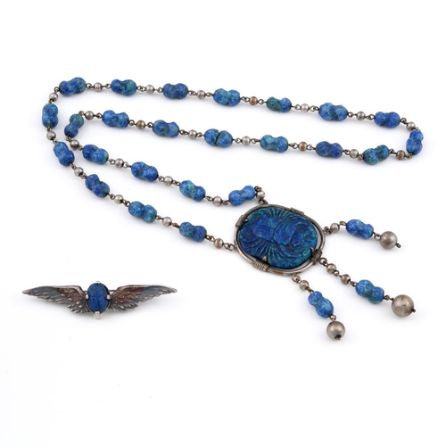 922 - A PATE DE VERRE NECKACE. depicting a scarab, mounted in metal, the pendant 4.5cm long.  **BP 22.5% i... 