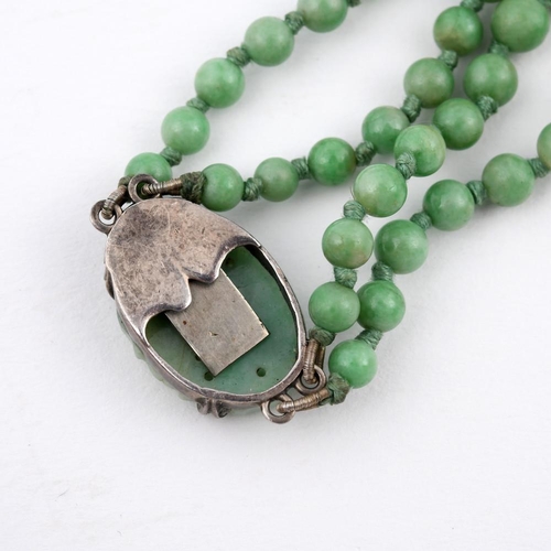 924 - A TWO ROW GRADUATED JADE BEAD NECKLACE. the jade beads graduate from approximately 4.1 to 9.8mm to a... 