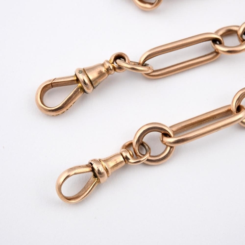 942 - A 9CT GOLD WATCH CHAIN. formed with long oval and circular links, 40cm long, 42.2 grams.  **BP 22.5%... 