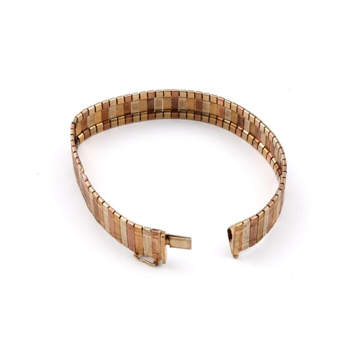 948 - A 9CT THREE COLOUR GOLD BRACELET. formed with alternate panels of gold, with engine turned decoratio... 