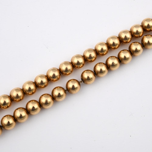 959 - A SINGLE ROW UNIFORM GOLD BEAD NECKLACE. 39cm long, 29 grams.  **BP 22.5% inc VAT + Lot Fee of £8