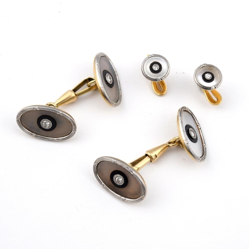 973 - A PAIR OF CHALCEDONY, BLACK ONYX AND DIAMOND CUFFLINKS. each oval-shaped chalcedony link centred wit... 