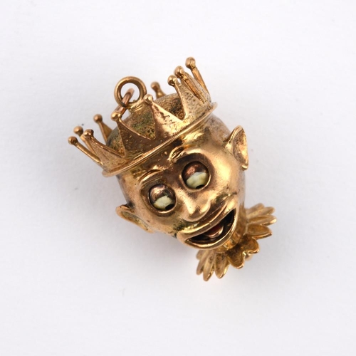 975 - A 9CT GOLD JESTER PENDANT. with pull-out mechanism to change expressions, 3cm long, 14.7 grams.  **B... 