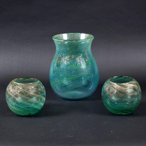 761 - LARGE MONART ART GLASS VASE. A large green glass vase with a swirling design and gold coloured infle... 