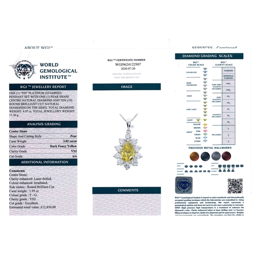 1190 - A FANCY YELLOW DIAMOND AND DIAMOND CLUSTER PENDANT. the pear-shaped fancy yellow diamond is set with... 