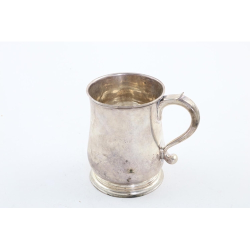 116 - A GEORGE II BALUSTER MUG. with a scroll handle and spreading circular foot, crested, London 1731 (ma... 