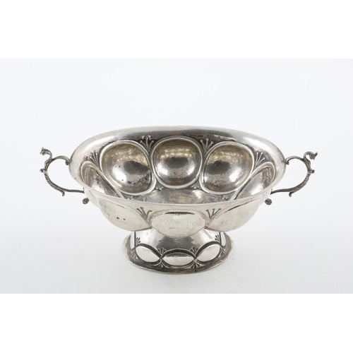 138 - A LATE 19TH/EARLY 20TH CENTURY DUTCH BRANDY BOWL. of lobed oval form, on a domed foot, with two scro... 