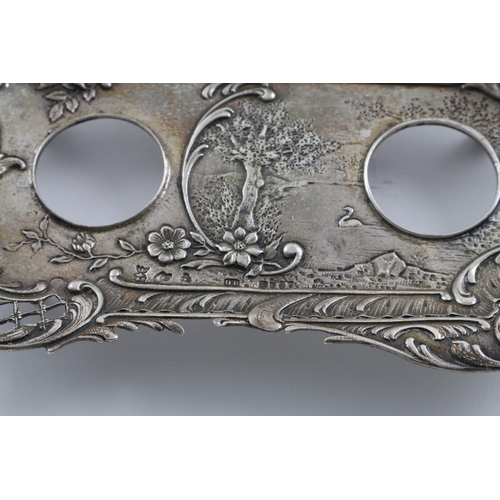 141 - A LATE 19TH CENTURY INKSTAND. of shaped rectangular form, with a pierced floral and scroll border an... 