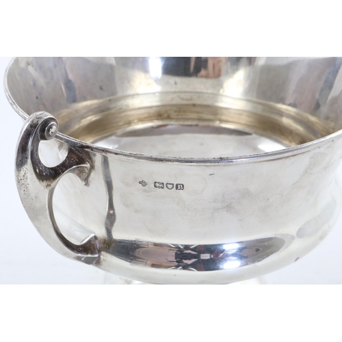 156 - AN EDWARDIAN ART NOUVEAU TWO-HANDLED BOWL. with two flying scroll handles and a slightly flaring cir... 