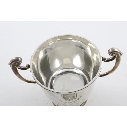 157 - A GEORGE V TWO-HANDLED CUP AND COVER. the domed cover with a fluted finial, the body with  scroll ha... 