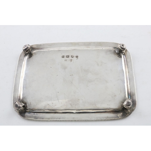 175 - A GEORGE III TRAY. of rounded rectangular form, with a gadrooned border, incurved corners and four s... 