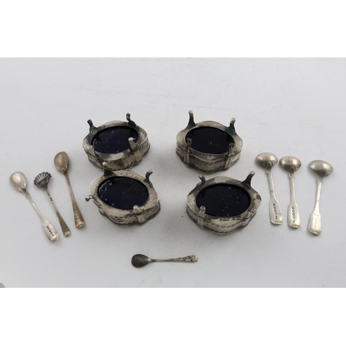 176 - A SET OF FOUR LATE VICTORIAN PIERCED SALTS. of shaped oval outline, with engraved decoration, blue g... 