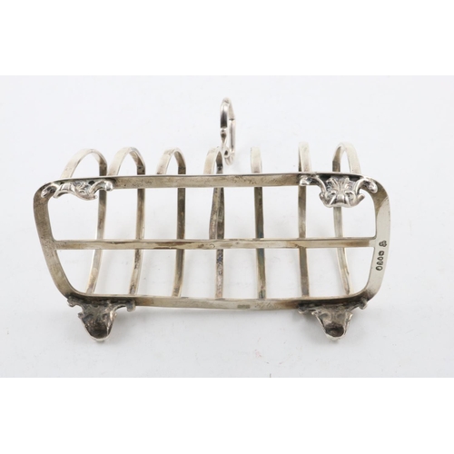 180 - A VICTORIAN TOAST RACK. with seven arched bars and a central handle, by Henry John Lias & James Wake... 