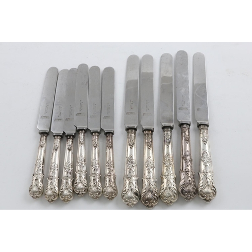 49 - A SET OF FIVE VICTORIAN TABLE KNIVES AND SIX MATCHING SIDE KNIVES. of a decorative pattern, with fru... 