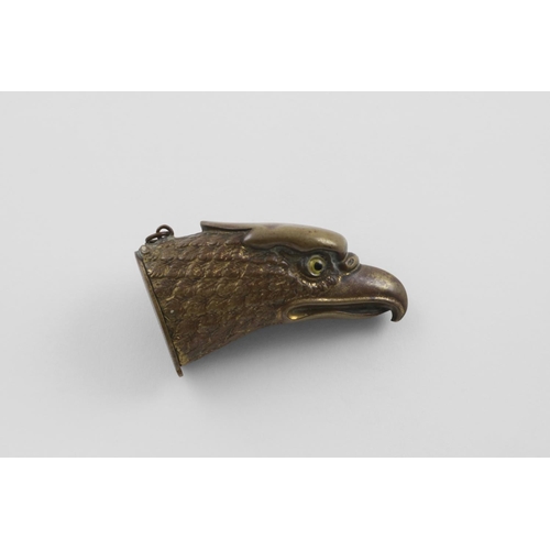 87 - A LATE 19TH/EARLY 20TH CENTURY GILT BRASS EAGLE HEAD VESTA CASE. with two glass eyes and a suspensor... 