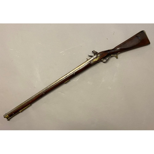 1 - AN EARLY 19TH CENTURY 'BAKER' TYPE RIFLE WITH ISSUE MARKS. A flintlock rifle with a 77cm rifled barr... 