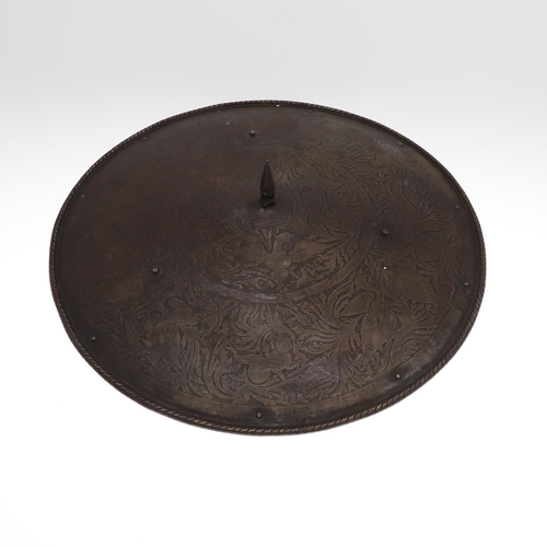 100 - A 19TH CENTURY CIRCULAR SHIELD WITH CENTRAL SPIKE. A lightly dished circular shield with central squ... 