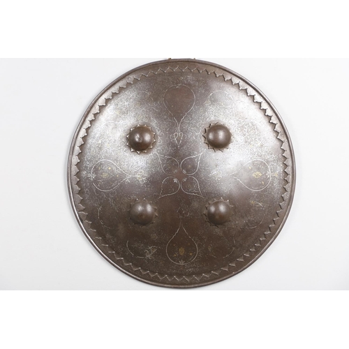 111 - AN INDO PERSIAN DHAL TYPE CIRCULAR SHIELD. A heavy steel shield with four raised bosses covering fix... 