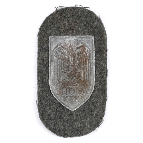 255 - A SECOND WORLD WAR GERMAN CHOLM SHIELD. A Cholm 1942 shield with dark grey finish, on a fieldgrey ba... 