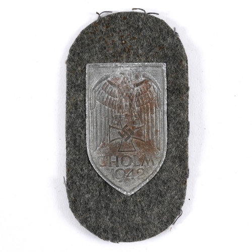 255 - A SECOND WORLD WAR GERMAN CHOLM SHIELD. A Cholm 1942 shield with dark grey finish, on a fieldgrey ba... 