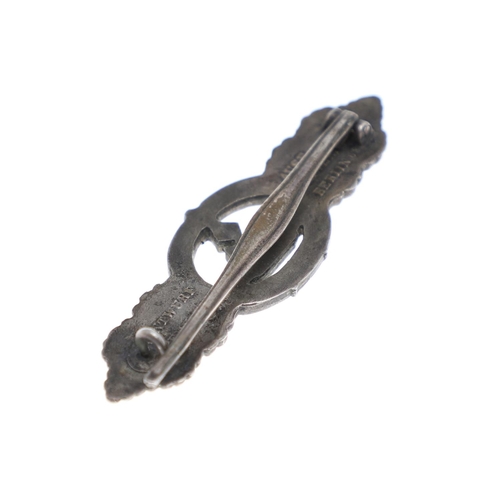 258 - A SECOND WORLD WAR GERMAN KRIEGSMARINE U-BOAT CLASP IN SILVER. A U Boat clasp with eagle with Swasti... 