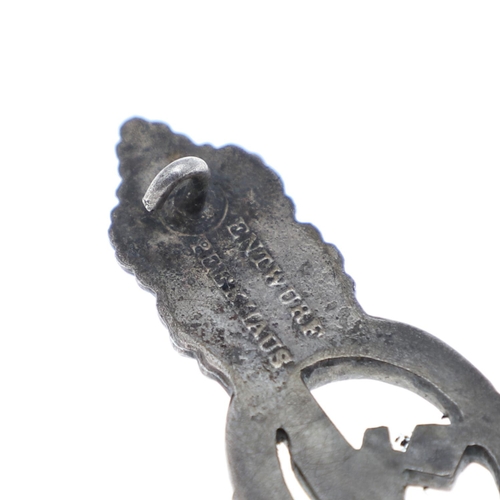 258 - A SECOND WORLD WAR GERMAN KRIEGSMARINE U-BOAT CLASP IN SILVER. A U Boat clasp with eagle with Swasti... 