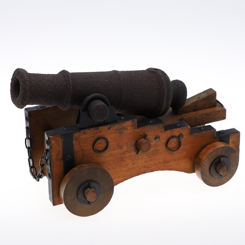 32 - A NINETEENTH CENTURY SIGNAL CANNON ON LATER CARRIAGE. A nineteenth century signal cannon with a 25cm... 