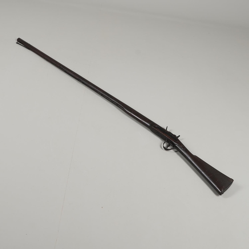 4 - A 19TH CENTURY FLINTLOCK LONG GUN. With a 128 cm, tapering to octagonal, with flintlock action, the ... 