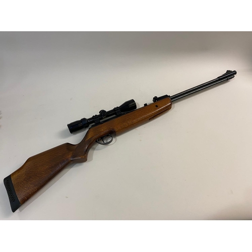 42 - A BSA .22 AIR RIFLE. A BSA .22 the barrel marked RH 19807, with sliding safety, with a Bushnell Opti... 