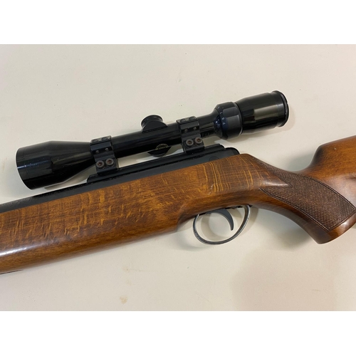 42 - A BSA .22 AIR RIFLE. A BSA .22 the barrel marked RH 19807, with sliding safety, with a Bushnell Opti... 