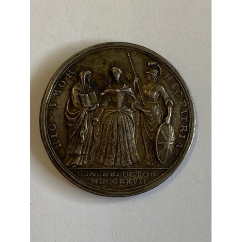 447 - A GEOGE II MEDAL COMMEORATING THE CORONATION OF CAROLINE 1727. A silver medal, obverse with bust of ... 