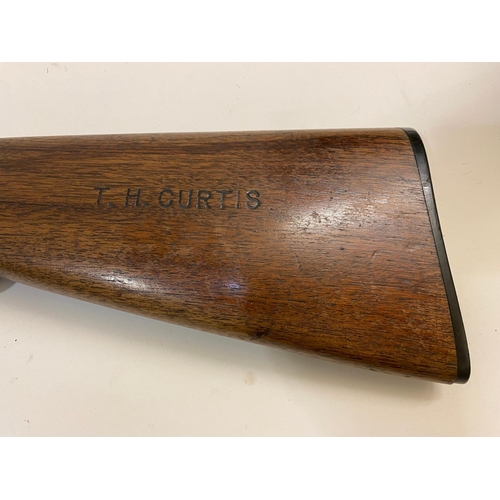 48 - A WINCHESTER 'MODEL 1897' PUMP ACTION SHOTGUN.  A Winchester 'Pump Action' 12 bore shotgun, engraved... 