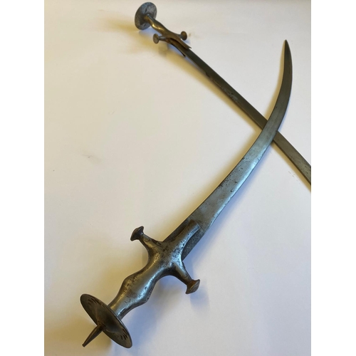 73 - A PAIR OF INDIAN 'TULWAR' TYPE SWORDS. A pair of swords with single edged 75cm blades, the handles w... 