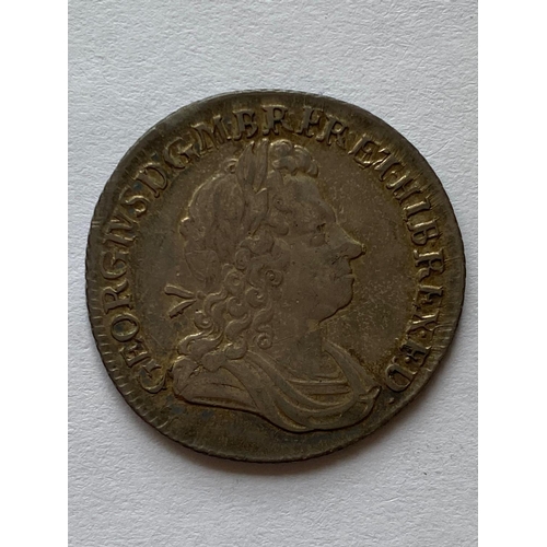 545 - A GEORGE I SHILLING. A George I Shilling dated 1723, first laureate and draped bust r. SSC in angles... 