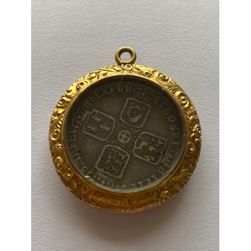 547 - A GEORGE II SIXPENCE IN GILT FOB MOUNT. A George II Sixpence, old laureate draped bust, l. reverse w... 