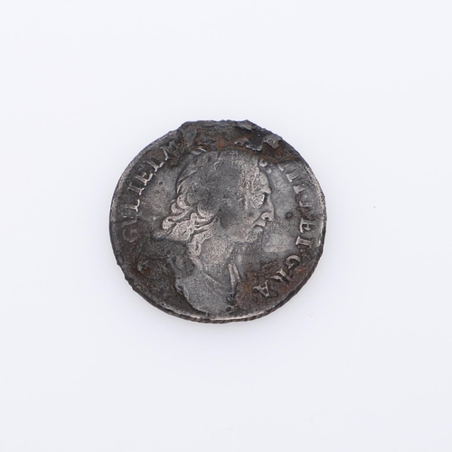 630 - A WILLIAM III SHIPWRECK SHILLING AND SIMILAR 8 REALES COIN. A William III Shilling, 1696, from the w... 