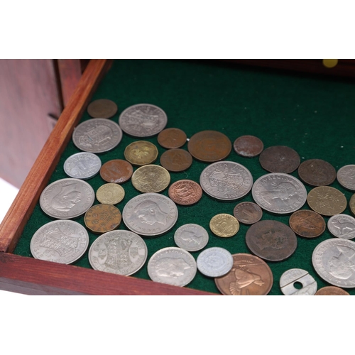 683 - AN EALY 20TH CENTURY STAINED PINE COIN COLLECTORS CABINET. A two door cabinet containing fifteen tra... 