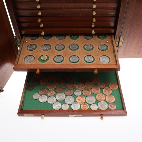 686 - A VICTORIAN MAHOGANY COIN CABINET AND CONTENTS. A Victorian Mahogany coin cabinet with a rectangular... 