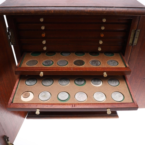 686 - A VICTORIAN MAHOGANY COIN CABINET AND CONTENTS. A Victorian Mahogany coin cabinet with a rectangular... 