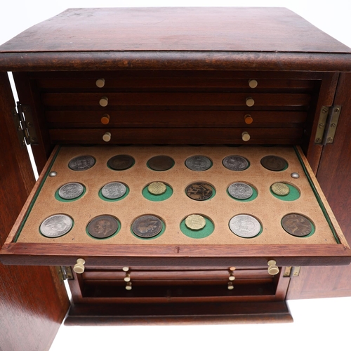 686 - A VICTORIAN MAHOGANY COIN CABINET AND CONTENTS. A Victorian Mahogany coin cabinet with a rectangular... 