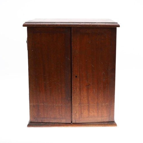 686 - A VICTORIAN MAHOGANY COIN CABINET AND CONTENTS. A Victorian Mahogany coin cabinet with a rectangular... 