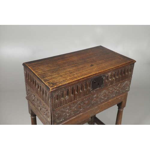 688 - A COIN CABINET MADE FROM A SEVENTEENTH CENTURY OAK BOX ON STAND. A coin or medal cabinet formed from... 