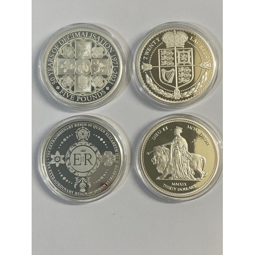 692 - FOUR JUBILEE MINT SILVER PROOF 5oz PRESENTATION COINS. Four Jubilee Mint 5oz silver coins: Tristan d... 